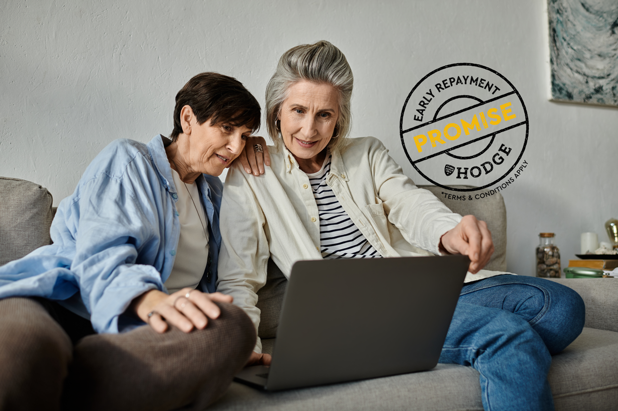 Early repayment logo with couple looking at laptop