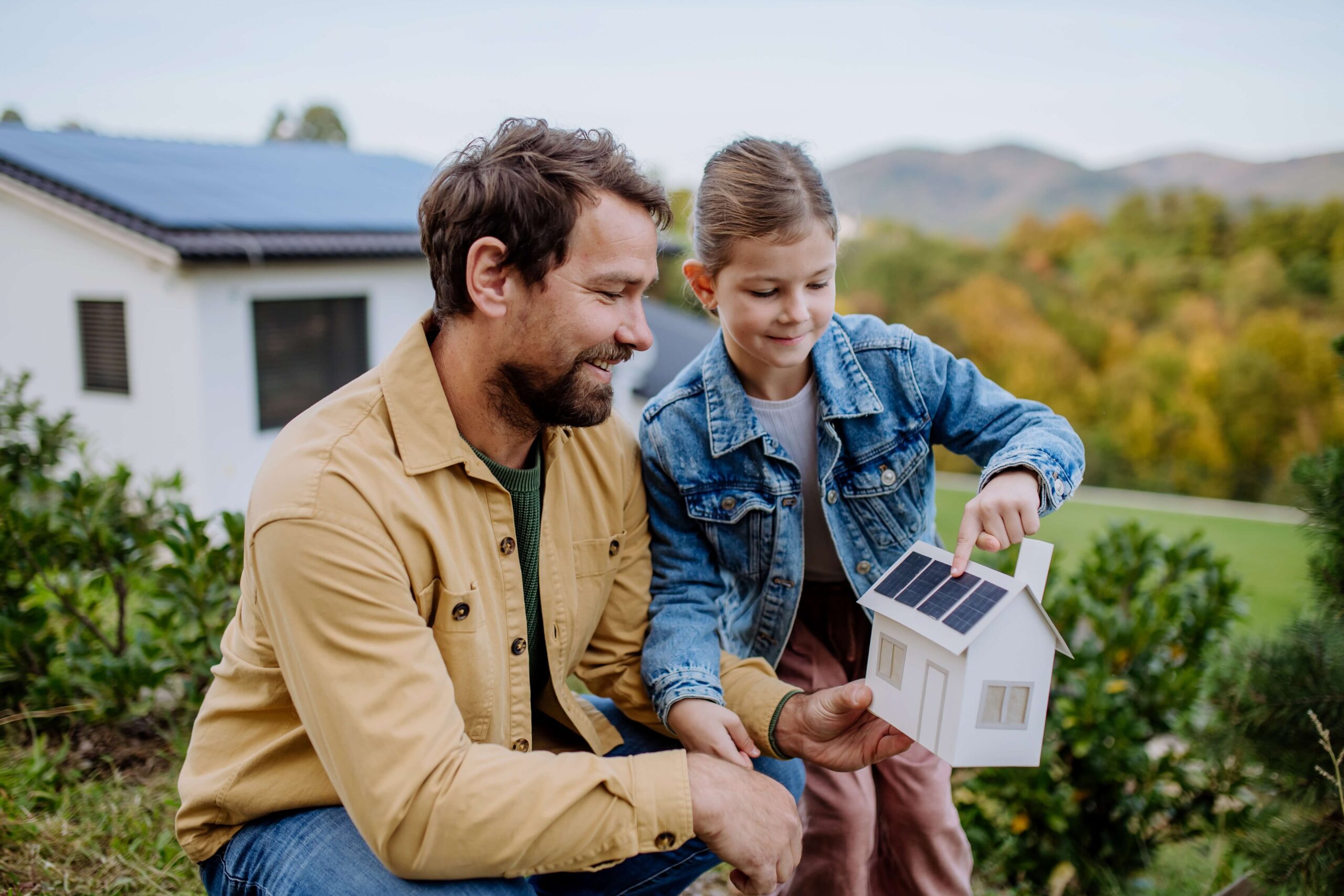 Father shows daughter eco house