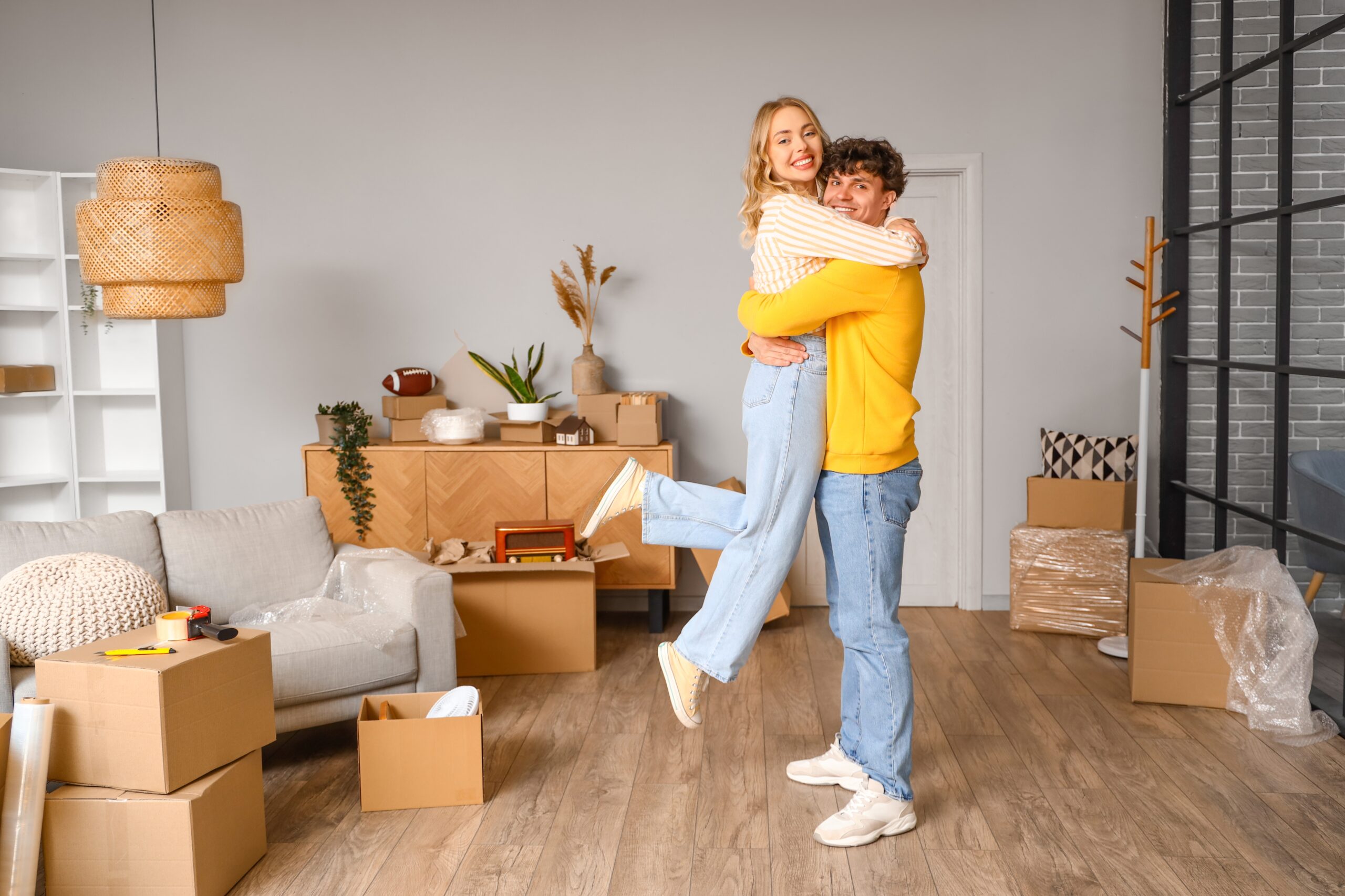 Young couple smiling and hugging eachother