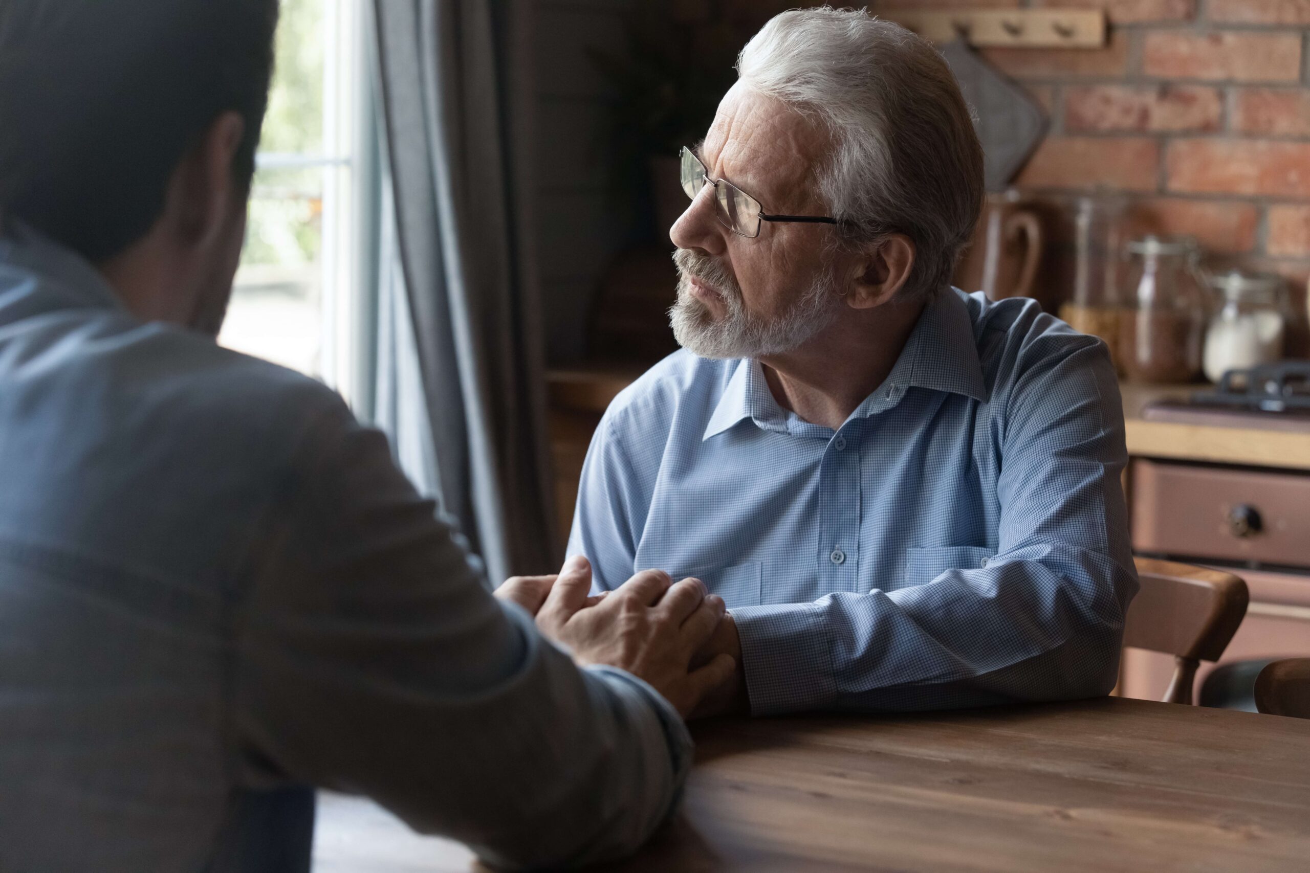 Mature man and son sad