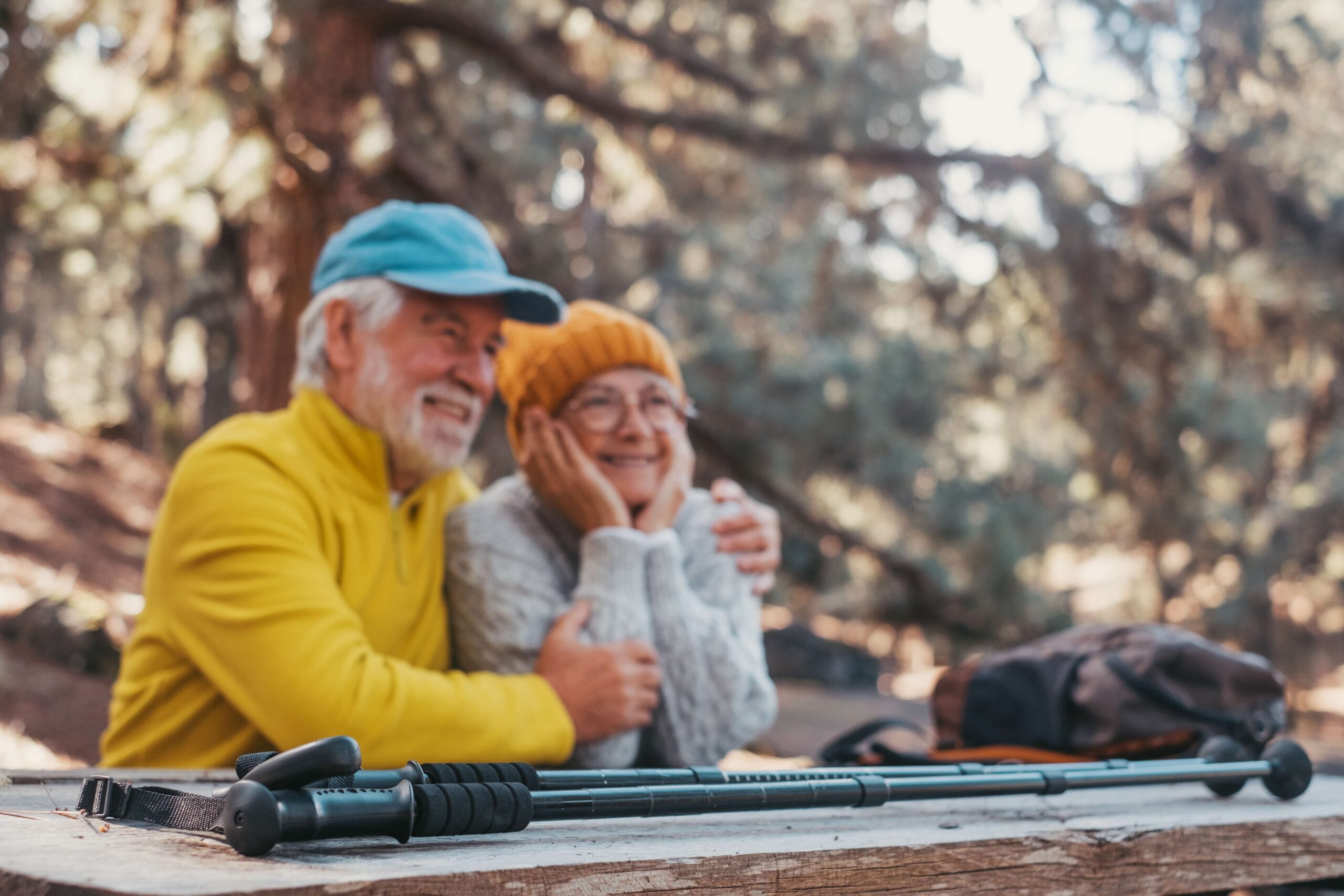 mature couple in woods sat down