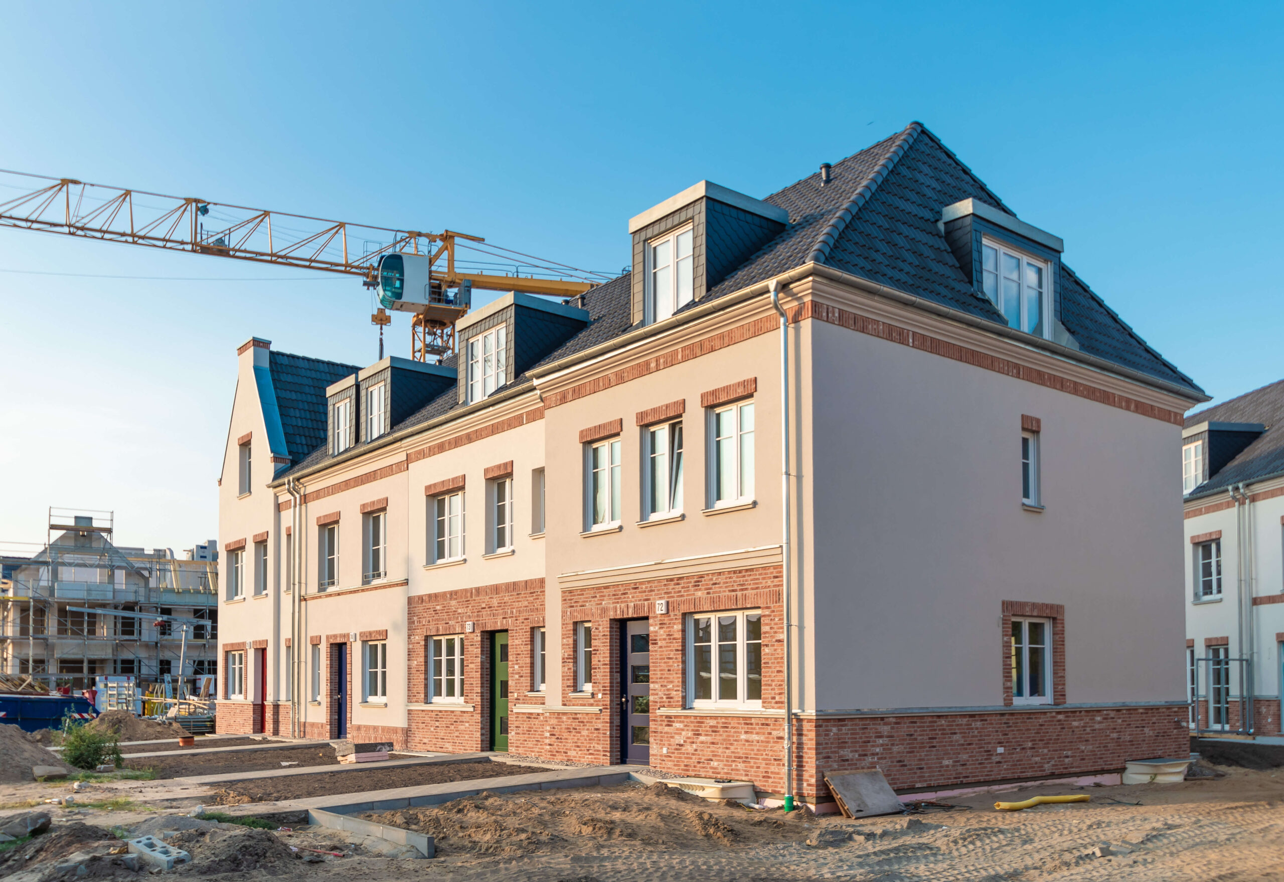 Newly built residential houses with crane