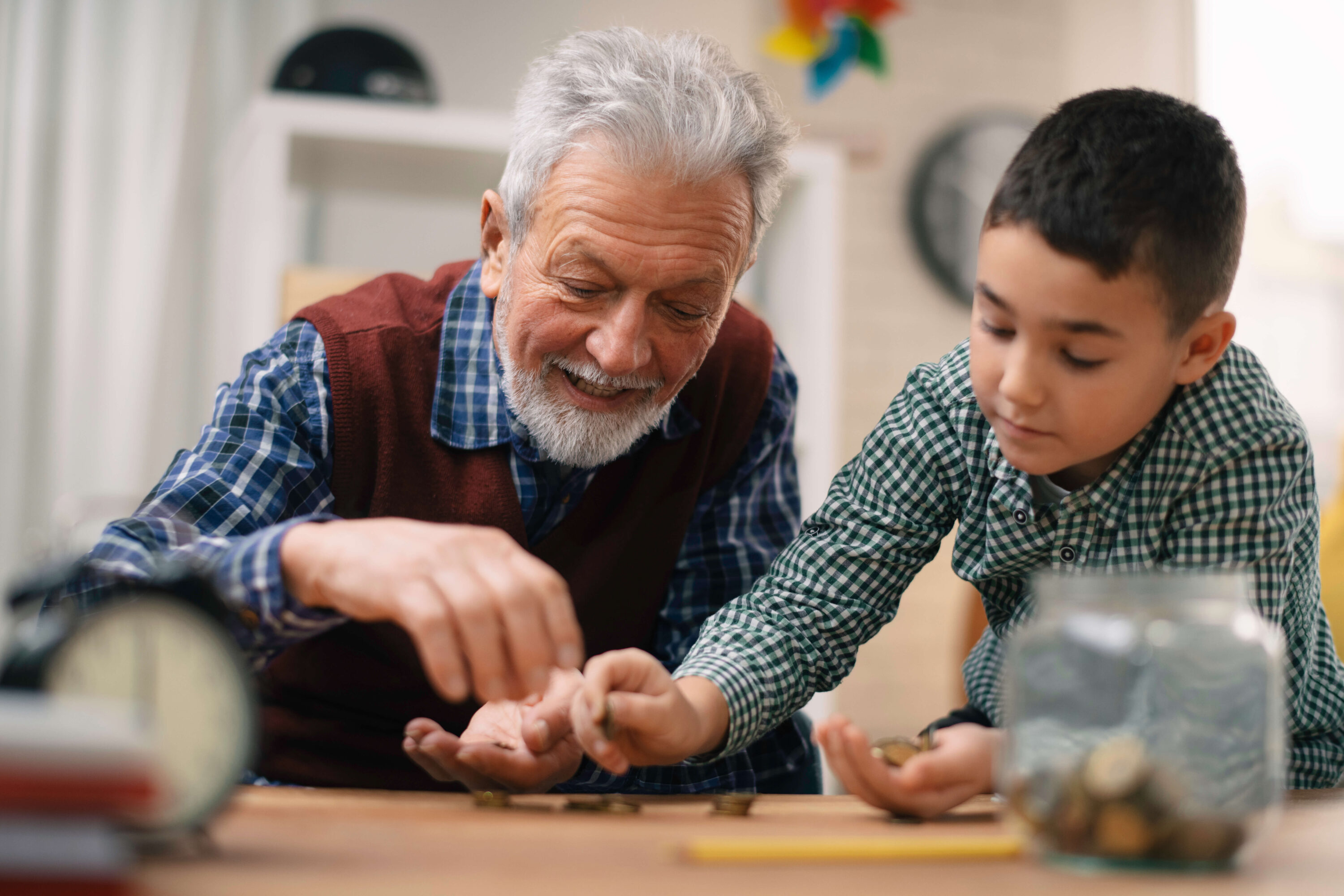 Grandfather and grandson counting money