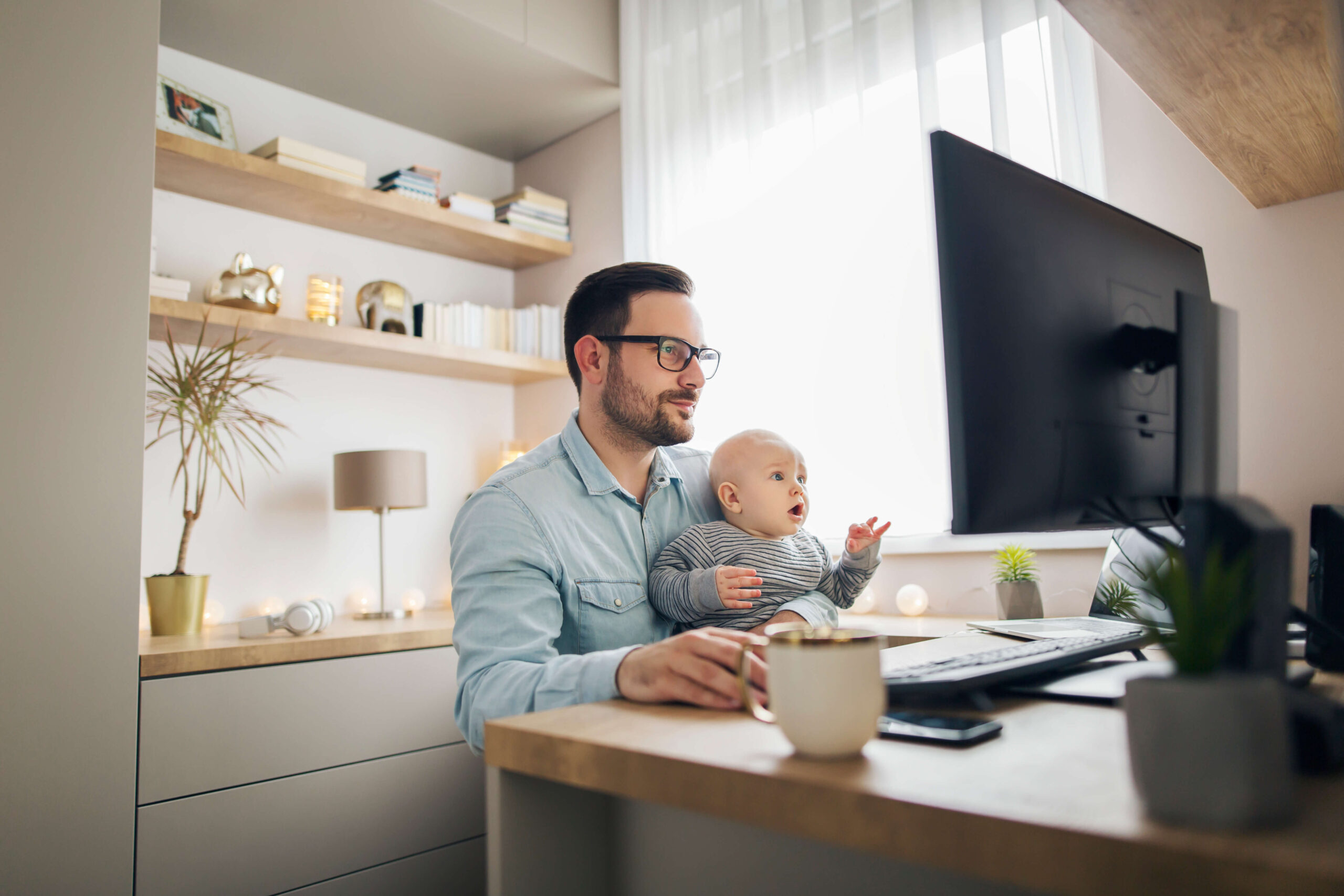 Young dad home working