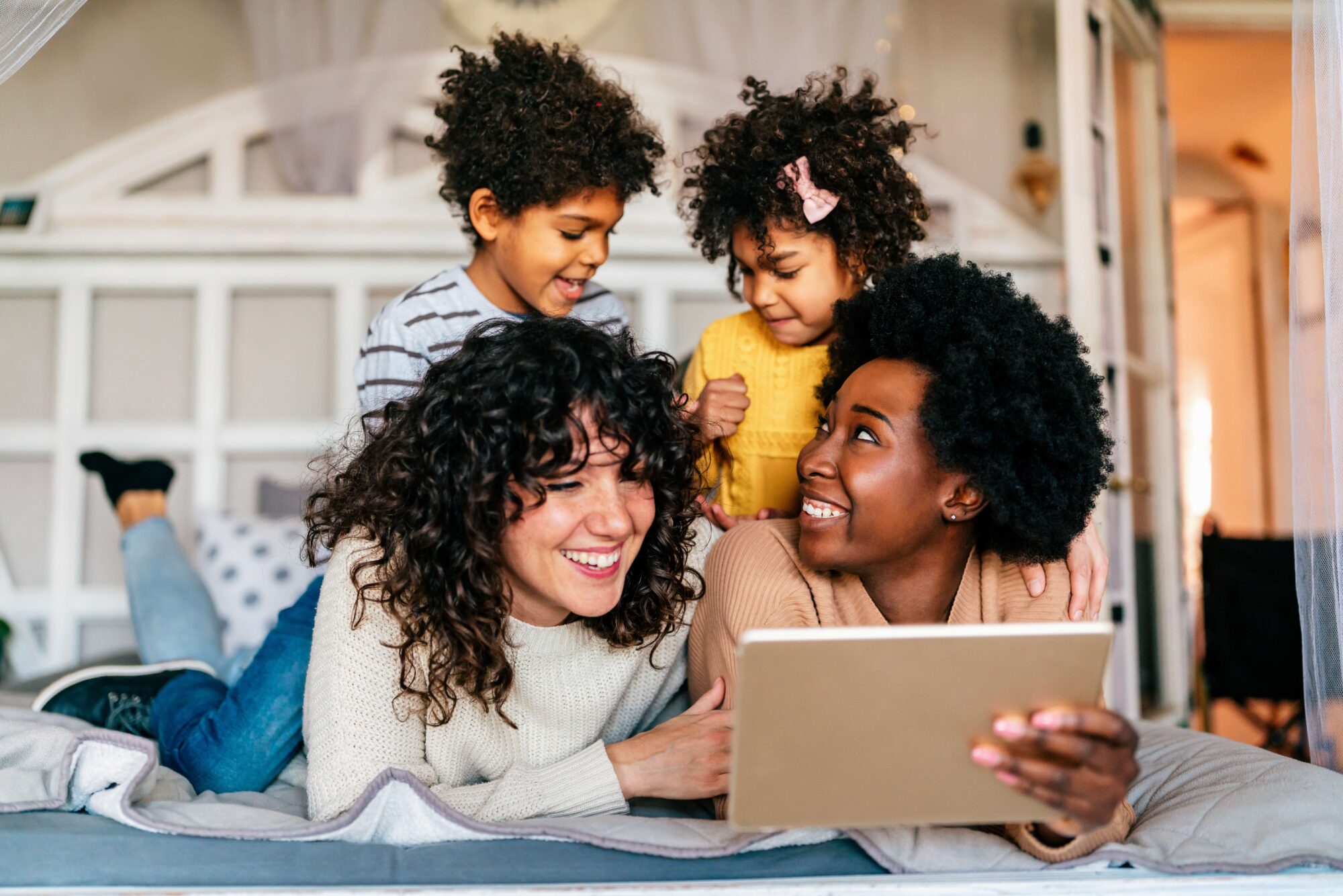 Young family happy looking at tablet