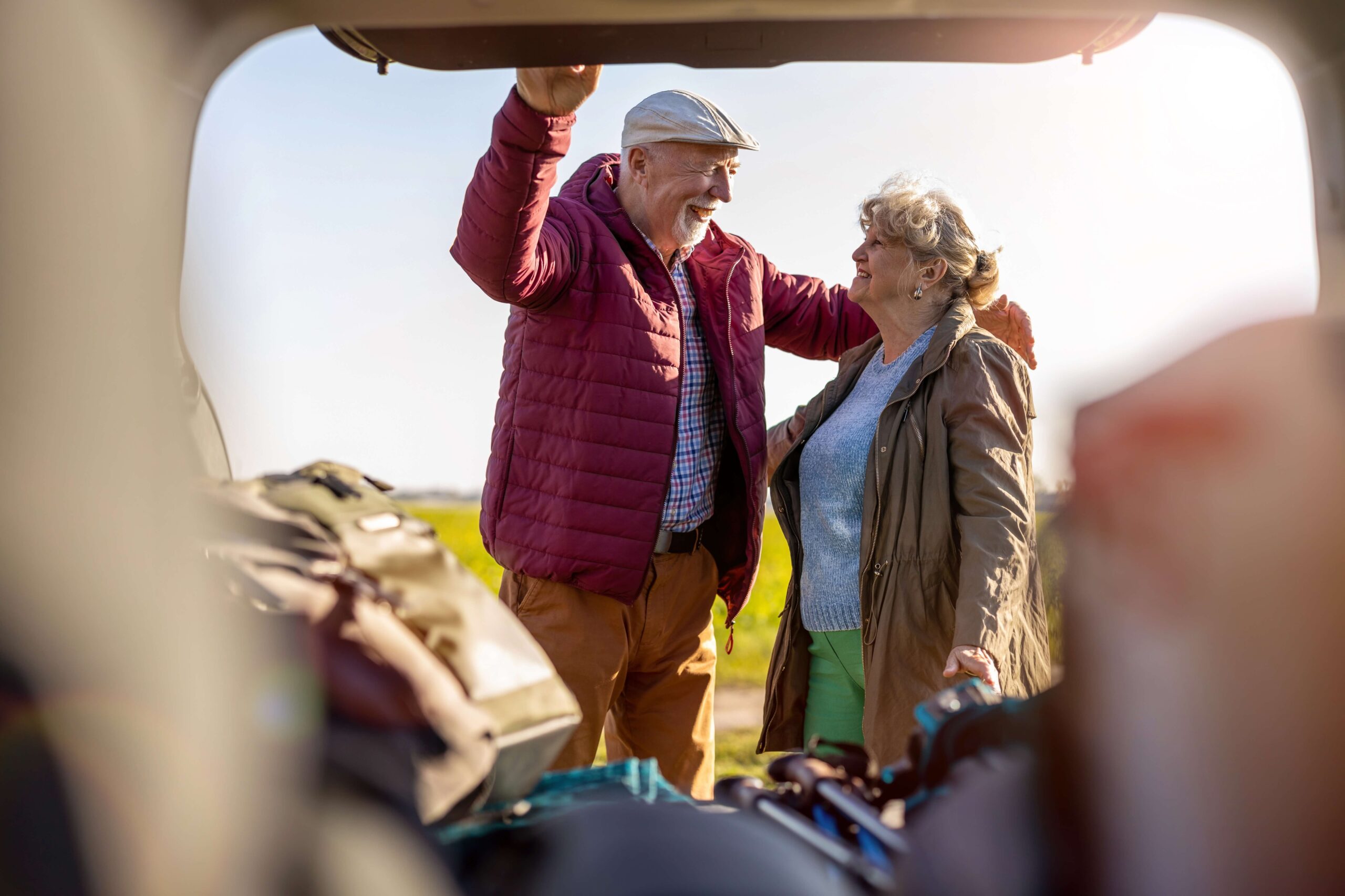 Mature couple laughing and camping