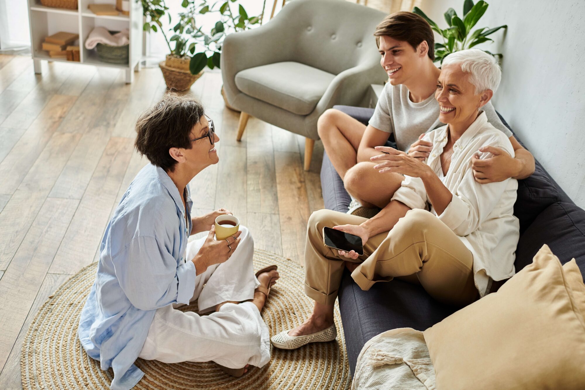 Lesbian couple with older son happy at home