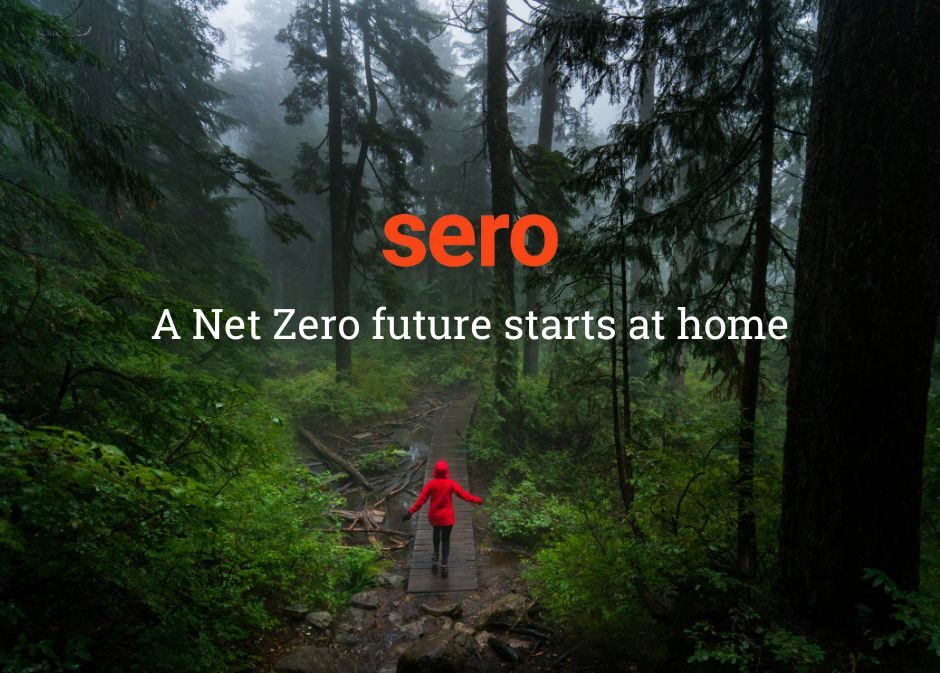 Sero - a net zero future starts at home in words. With person in red raincoat walking through green wet forest