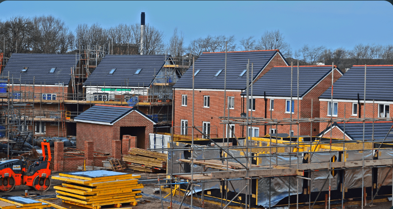 Houses with scaffolding on and around them