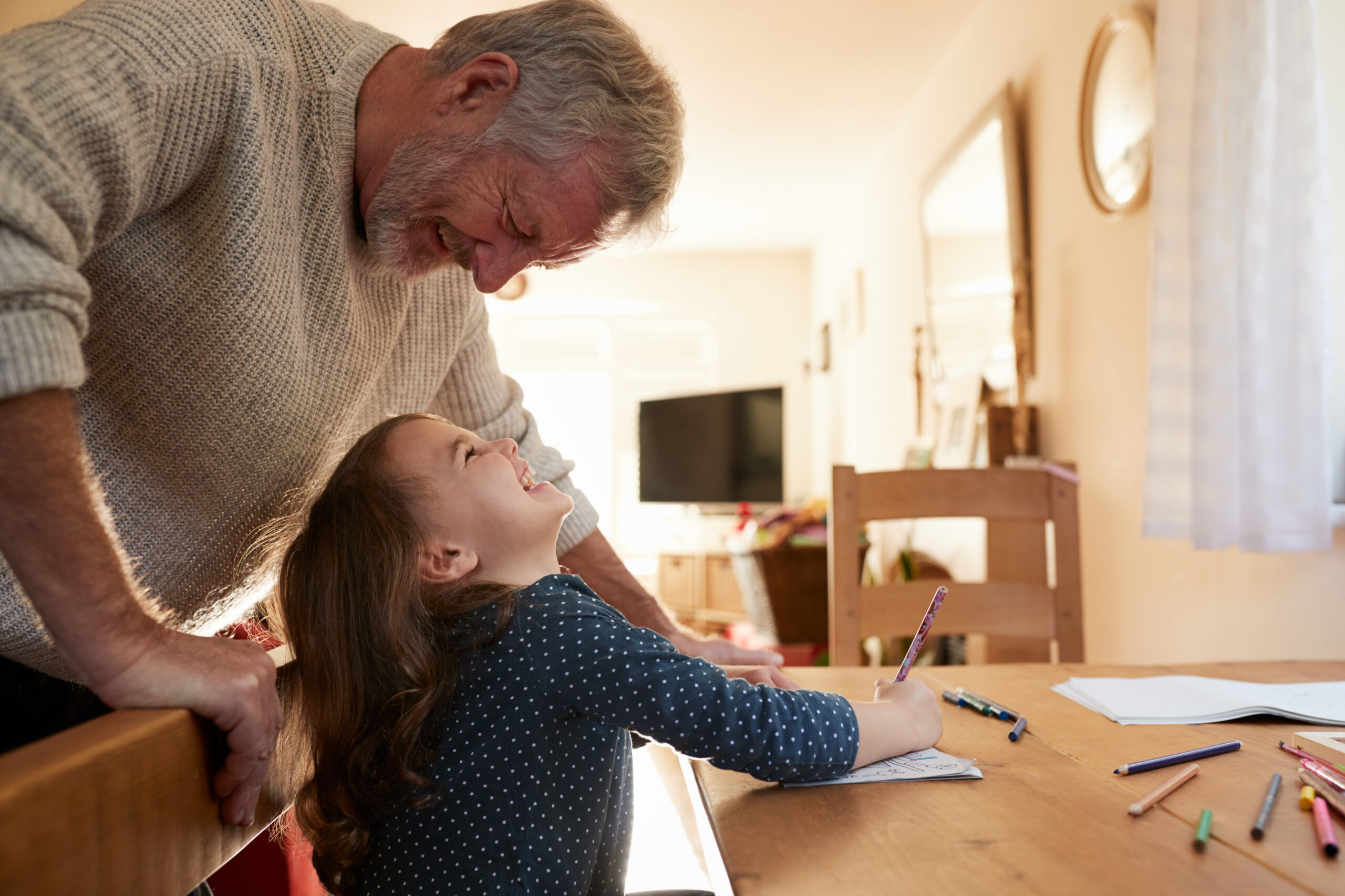 Grandfather and granddaughter playing