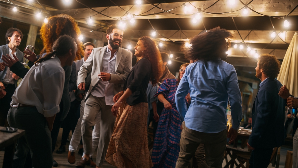 Guests at a wedding, dancing together