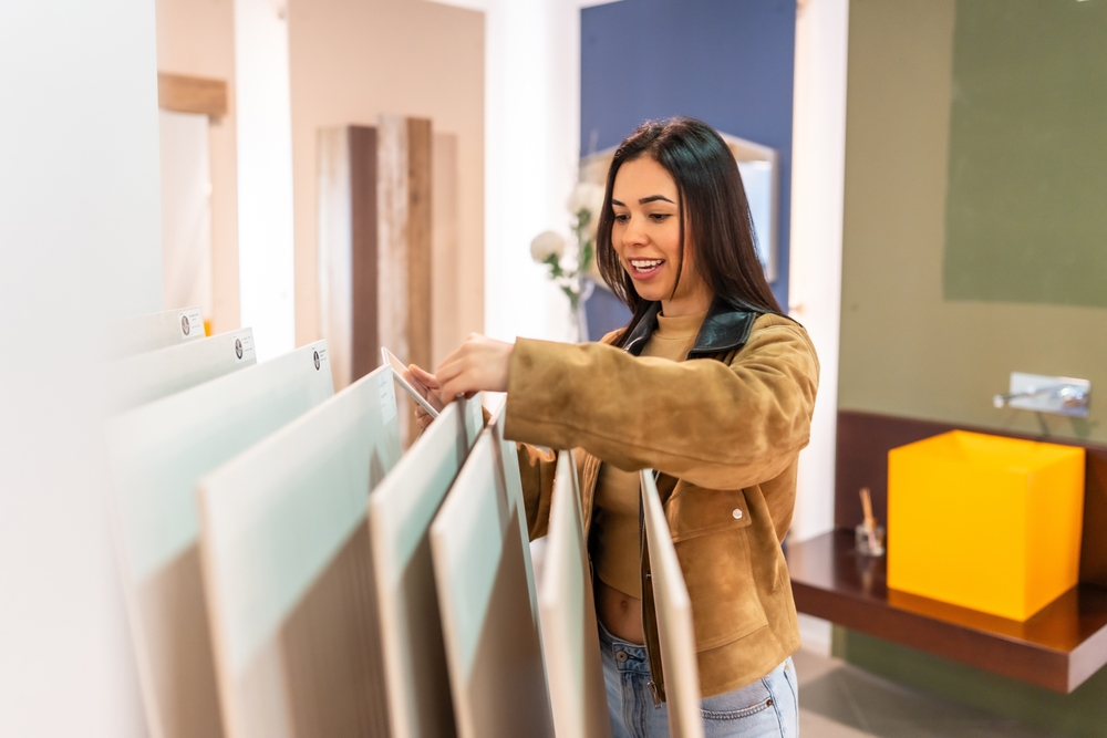 Woman choosing ceramic tiles