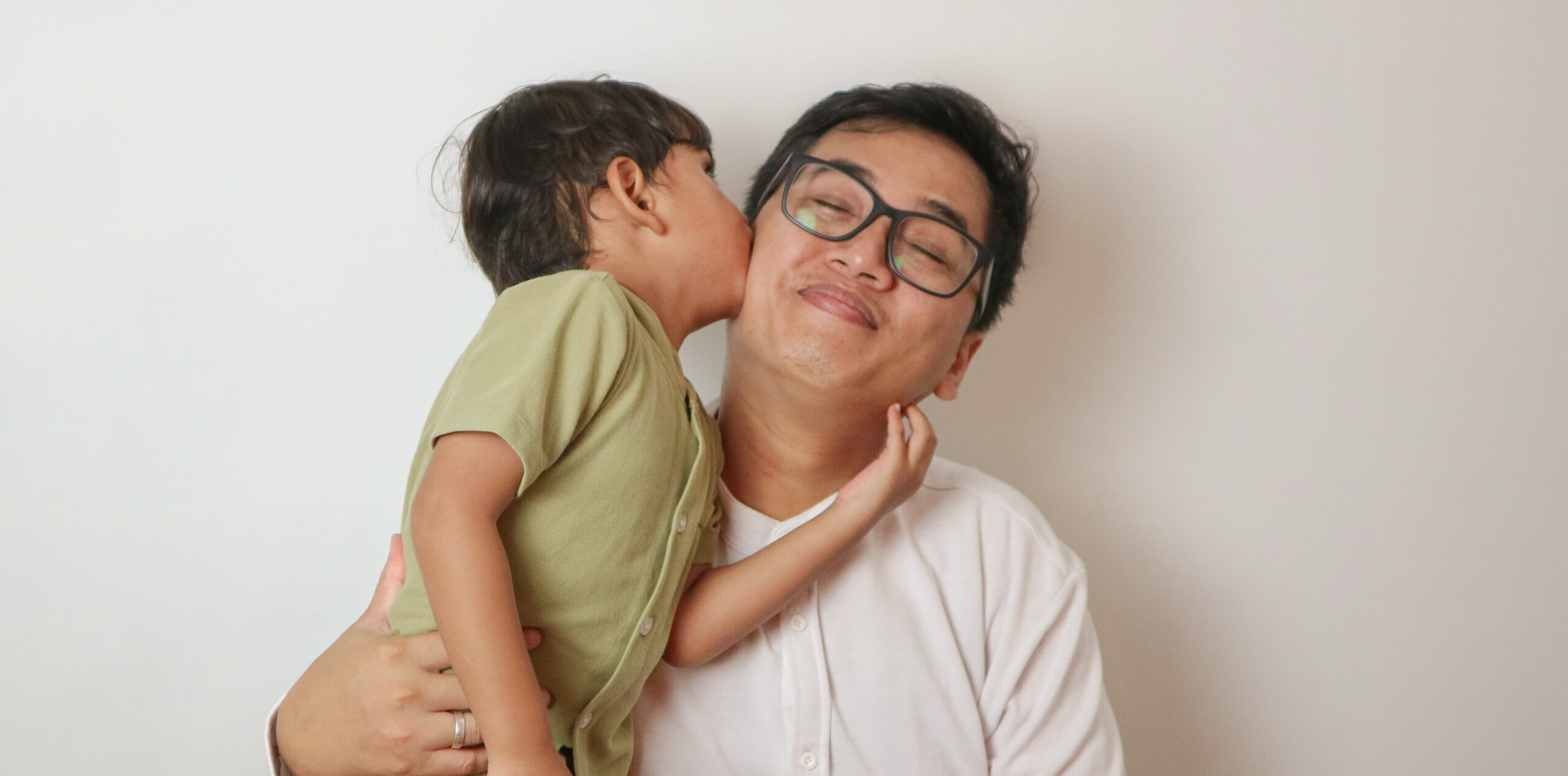 A man holding his child in his arms